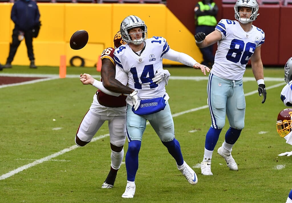 Cowboys QB Andy Dalton fumbles during NFL Week 7 game against Washington.