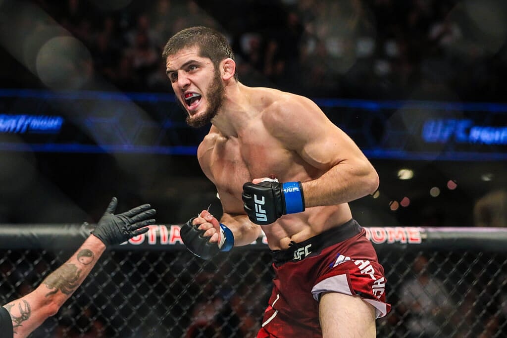 Jul 28, 2018; Calgary, Alberta, Canada; Islam Makhachev (blue gloves) defeats Kajan Johnson (red gloves) during UFC Fight Night at Scotiabank Saddledome. Mandatory Credit: Sergei Belski-USA TODAY Sports