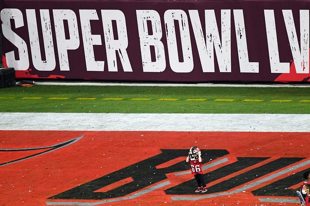 Feb 7, 2021; Tampa, FL, USA; Tampa Bay Buccaneers center Ryan Jensen's son Wyatt, wears his helmet after defeating the Kansas City Chiefs in Super Bowl LV at Raymond James Stadium.  Mandatory Credit: James Lang-USA TODAY Sports