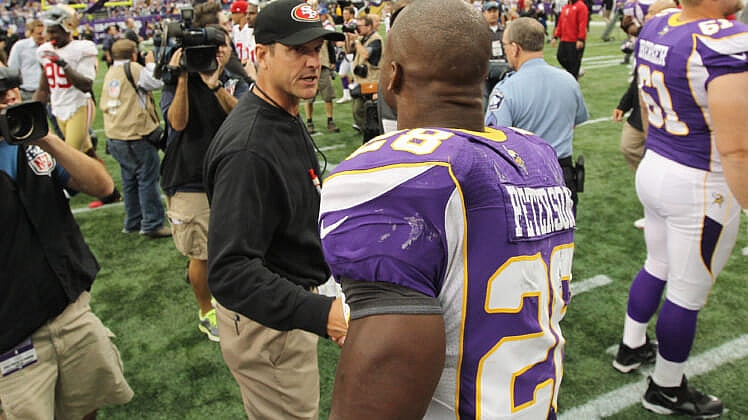 minnesota vikings hire jim harbaugh