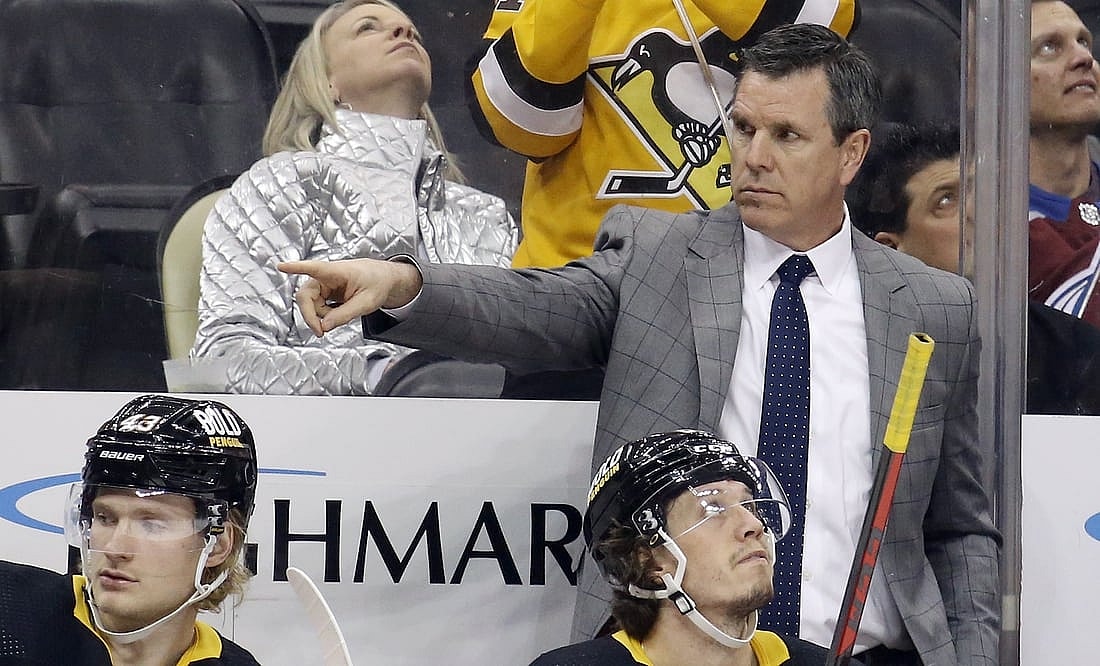 Apr 5, 2022; Pittsburgh, Pennsylvania, USA;  Pittsburgh Penguins head coach Mike Sullivan gestures on the bench against the Colorado Avalanche during the third period at PPG Paints Arena. Colorado won 6-4. Mandatory Credit: Charles LeClaire-USA TODAY Sports