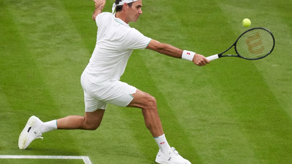 Jun 29, 2021; London, United Kingdom;  Roger Federer (SUI) in action Adrian Mannarino (FRA) in first round  singles on centre court at All England Lawn Tennis and Croquet Club. Mandatory Credit: Peter Van den Berg-USA TODAY Sports