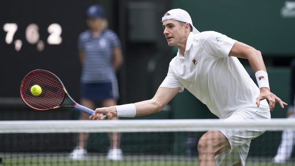 Jun 29, 2022; London, United Kingdom; John Isner (USA) returns a shot during his second round match against Andy Murray (GBR) on day three at All England Lawn Tennis and Croquet Club. Mandatory Credit: Susan Mullane-USA TODAY Sports

