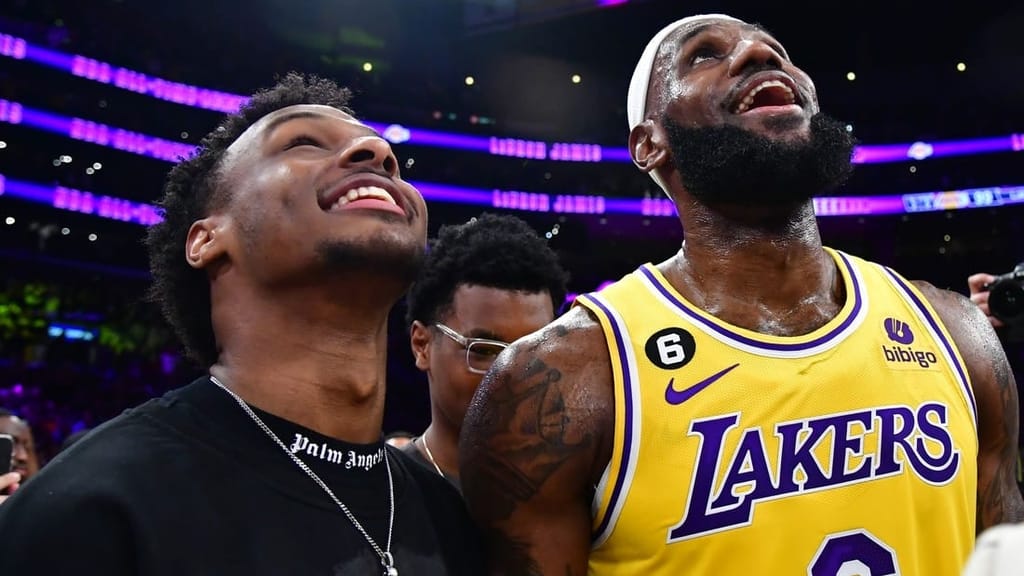 Feb 7, 2023; Los Angeles, California, USA; Los Angeles Lakers forward LeBron James (6) celebrates with his son Bronny James after breaking the all-time scoring record in the third quarter against the Oklahoma City Thunder at Crypto.com Arena. Mandatory Credit: Gary A. Vasquez-USA TODAY Sports