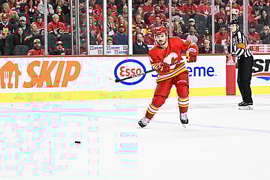 CALGARY, AB - OCTOBER 18: Calgary Flames Defenceman Rasmus Andersson (4) passes the puck during the second period of an NHL game between the Calgary Flames and the Vegas Golden Knights on October 18, 2022, at the Scotiabank Saddledome in Calgary, AB. (Photo by Brett Holmes/Icon Sportswire)