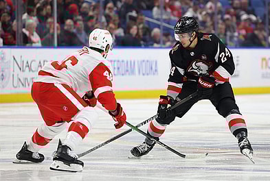 Mar 12, 2024; Buffalo, New York, USA;  Buffalo Sabres center Dylan Cozens (24) carries the puck up ice as Detroit Red Wings defenseman Jeff Petry (46) defends during the second period at KeyBank Center. Mandatory Credit: Timothy T. Ludwig-USA TODAY Sports