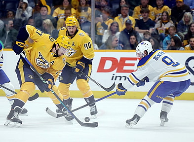 Mar 7, 2024; Nashville, Tennessee, USA; Nashville Predators defenseman Ryan McDonagh (27) breaks up an attack by Buffalo Sabres left wing Zach Benson (9) during their game at Bridgestone Arena. Mandatory Credit: Alan Poizner-USA TODAY Sports