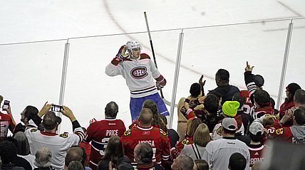 Nov 25, 2022; Chicago, Illinois, USA; Montreal Canadiens center Kirby Dach (77) celebrates the game winning goal against the Chicago Blackhawks during a shootout at United Center. Mandatory Credit: David Banks-USA TODAY Sports