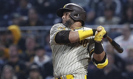 Jun 27, 2023; Pittsburgh, Pennsylvania, USA;  San Diego Padres designated hitter Nelson Cruz (32) hits a RBI single against the Pittsburgh Pirates during the sixth inning at PNC Park. Mandatory Credit: Charles LeClaire-USA TODAY Sports