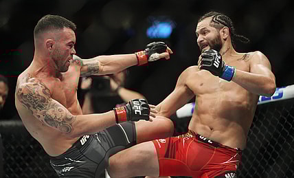 Mar 5, 2022; Las Vegas, Nevada, UNITED STATES; Colby Covington (red gloves) fights Jorge Masvidal (blue gloves) during UFC 272 at T-Mobile Arena. Mandatory Credit: Stephen R. Sylvanie-USA TODAY Sports