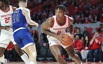 Dec 21, 2022; Houston, Texas, USA; Houston Cougars guard Marcus Sasser (0) grabs a rebound during the first half against the McNeese State Cowboys at Fertitta Center. Mandatory Credit: Troy Taormina-USA TODAY Sports