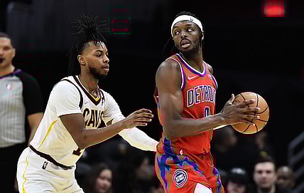 Mar 19, 2022; Cleveland, Ohio, USA; Cleveland Cavaliers guard Darius Garland (10) defends Detroit Pistons forward Jerami Grant (9) during the second half at Rocket Mortgage FieldHouse. Mandatory Credit: Ken Blaze-USA TODAY Sports