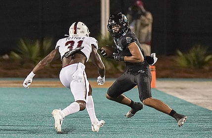 Oct 28, 2021; Conway, South Carolina, USA; Coastal Carolina Chanticleers wide receiver Jaivon Heiligh (6) catches a pass against Troy Trojans safety Dell Pettus (31) during the first half at Brooks Stadium. Mandatory Credit: David Yeazell-USA TODAY Sports