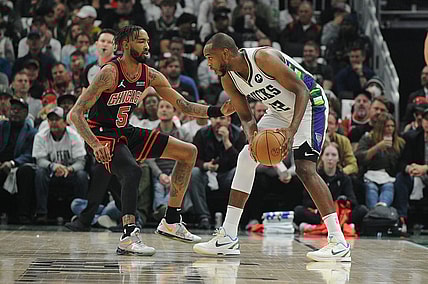 Apr 20, 2022; Milwaukee, Wisconsin, USA; Chicago Bulls forward Derrick Jones Jr. (5) defends Milwaukee Bucks forward Khris Middleton (22) in the first half during game two of the first round for the 2022 NBA playoffs at Fiserv Forum. Mandatory Credit: Michael McLoone-USA TODAY Sports