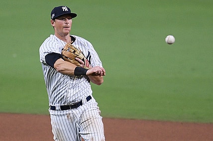 Oct 8, 2020; San Diego, California, USA; New York Yankees second baseman DJ LeMahieu (26) throws to first base to retire Tampa Bay Rays shortstop Willy Adames (not pictured) during the seventh inning of game four of the 2020 ALDS at Petco Park. Mandatory Credit: Orlando Ramirez-USA TODAY Sports