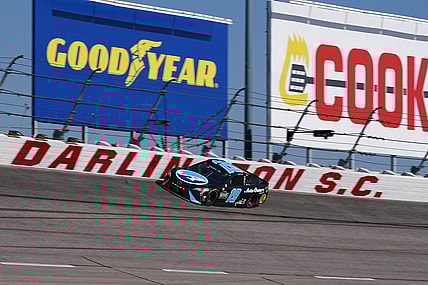 May 9, 2021; Darlington, South Carolina, USA; NASCAR Cup Series driver Martin Truex Jr. (19) races during the Goodyear 400 at Darlington Raceway. Mandatory Credit: Jasen Vinlove-USA TODAY Sports