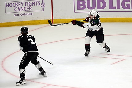 Nov 21, 2021; Los Angeles, California, USA; Arizona Coyotes defenseman Kyle Capobianco (75) shoots the game winning shot in the overtime against the Los Angeles King at Staples Center. The Coyotes wins 2-1. Mandatory Credit: Kiyoshi Mio-USA TODAY Sports