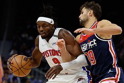 Dec 8, 2021; Detroit, Michigan, USA;  Detroit Pistons forward Jerami Grant (9) dribbles defended by Washington Wizards guard Raul Neto (19) in the second half at Little Caesars Arena. Mandatory Credit: Rick Osentoski-USA TODAY Sports