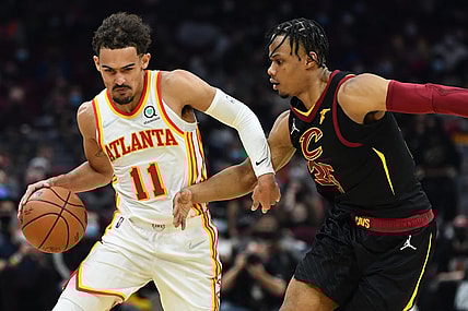 Dec 31, 2021; Cleveland, Ohio, USA; Atlanta Hawks guard Trae Young (11) drives to the basket against Cleveland Cavaliers forward Isaac Okoro (35) during the first half at Rocket Mortgage FieldHouse. Mandatory Credit: Ken Blaze-USA TODAY Sports