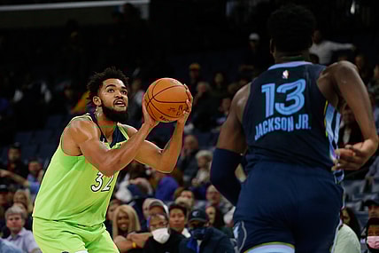 Nov 8, 2021; Memphis, Tennessee, USA; Minnesota Timberwolves center/forward Karl-Anthony Towns (32) shoots for three during the first half against the Memphis Grizzles at FedExForum. Mandatory Credit: Petre Thomas-USA TODAY Sports