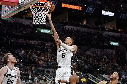Feb 1, 2022; San Antonio, Texas, USA;  San Antonio Spurs guard Dejounte Murray (5) shoots in the first half against the Golden State Warriors at the AT&T Center. Mandatory Credit: Daniel Dunn-USA TODAY Sports