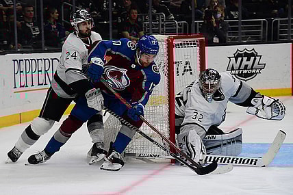Jan 20, 2022; Los Angeles, California, USA; Colorado Avalanche center Tyson Jost (17) moves in for a shot on goal against Los Angeles Kings goaltender Jonathan Quick (32) and center Phillip Danault (24) during the third period at Crypto.com Arena. Mandatory Credit: Gary A. Vasquez-USA TODAY Sports