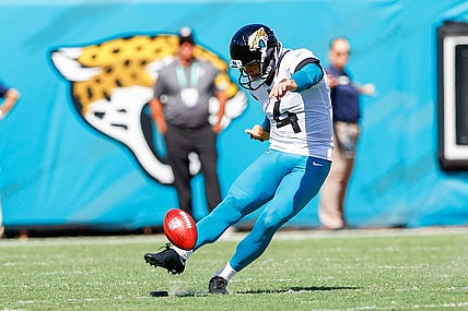 Sep 26, 2021; Jacksonville, Florida, USA;  Jacksonville Jaguars kicker Josh Lambo (4) kicks the ball in the third quarter against the Arizona Cardinals at TIAA Bank Field. Mandatory Credit: Nathan Ray Seebeck-USA TODAY Sports