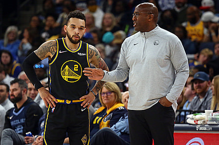 Mar 28, 2022; Memphis, Tennessee, USA; Golden State Warriors assistant coach Mike Brown (right) talks with guard Chris Chiozza (2) during the second half at FedExForum. Brown took over head coaching duties after head coach Steve Kerr (not pictured) was ejected from the game. Mandatory Credit: Petre Thomas-USA TODAY Sports