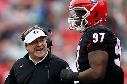 Georgia head coach Kirby Smart speaks with Georgia defensive lineman Warren Brinson (97) during the G-Day spring football game in Athens, Ga., on Saturday, April 16, 2022.

News Joshua L Jones