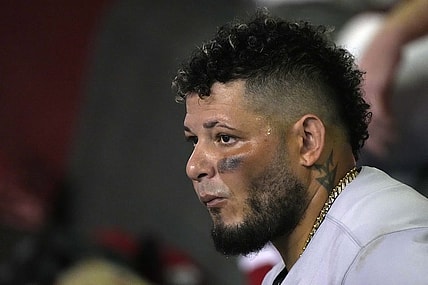 Aug 19, 2022; Phoenix, Arizona, USA; St. Louis Cardinals catcher Yadier Molina (4) watches from the dugout in the fourth inning against the Arizona Diamondbacks at Chase Field. Mandatory Credit: Rick Scuteri-USA TODAY Sports