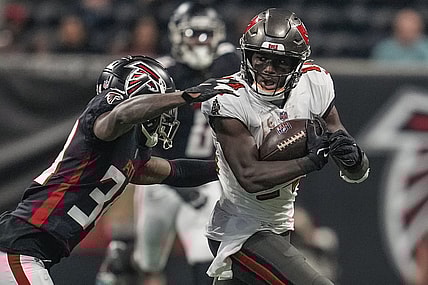 Dec 5, 2021; Atlanta, Georgia, USA; Tampa Bay Buccaneers wide receiver Chris Godwin (14) runs against Atlanta Falcons cornerback Darren Hall (34) during the first half at Mercedes-Benz Stadium. Mandatory Credit: Dale Zanine-USA TODAY Sports