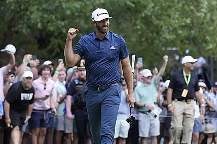 Sep 4, 2022; Boston, Massachusetts, USA; Dustin Johnson celebrates with a fist punch after putting to win the 2022 LIV Golf Invitational Boston after the final round playoff hole of the LIV Golf tournament at The International. Mandatory Credit: Richard Cashin-USA TODAY Sports