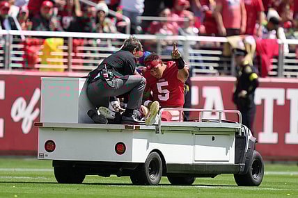 September 18, 2022; Santa Clara, California, USA; San Francisco 49ers quarterback Trey Lance (5) is carted off the field after an injury against the Seattle Seahawks during the first quarter at Levi's Stadium. Mandatory Credit: Kyle Terada-USA TODAY Sports