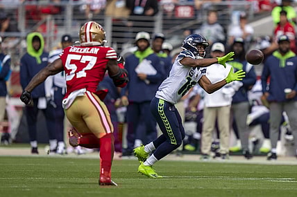 September 18, 2022; Santa Clara, California, USA; Seattle Seahawks wide receiver Tyler Lockett (16) catches the football against San Francisco 49ers linebacker Dre Greenlaw (57) during the second quarter at Levi's Stadium. Mandatory Credit: Kyle Terada-USA TODAY Sports