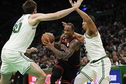 Nov 4, 2022; Boston, Massachusetts, USA;  Chicago Bulls forward DeMar DeRozan (11) controls the ball while Boston Celtics center Luke Kornet (40) and forward Grant Williams (12) defend during the second half at TD Garden. Mandatory Credit: Bob DeChiara-USA TODAY Sports