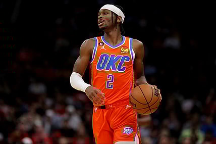 Nov 26, 2022; Houston, Texas, USA; Oklahoma City Thunder guard Shai Gilgeous-Alexander (2) handles the ball against the Houston Rockets during the game at Toyota Center. Mandatory Credit: Erik Williams-USA TODAY Sports