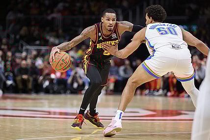 Dec 5, 2022; Atlanta, Georgia, USA; Atlanta Hawks guard Dejounte Murray (5) drives to the basket against the Oklahoma City Thunder in the second quarter at State Farm Arena. Mandatory Credit: Brett Davis-USA TODAY Sports