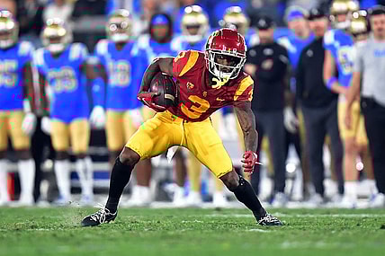 Nov 19, 2022; Pasadena, California, USA; Southern California Trojans wide receiver Jordan Addison (3) runs the ball against the UCLA Bruins during the first half at the Rose Bowl. Mandatory Credit: Gary A. Vasquez-USA TODAY Sports