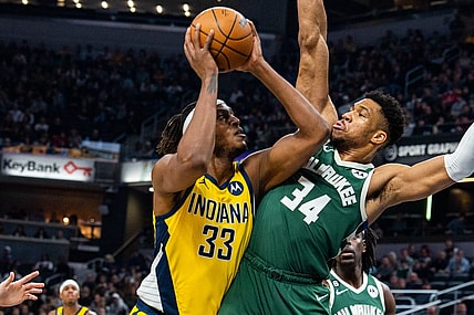 Jan 27, 2023; Indianapolis, Indiana, USA; Indiana Pacers center Myles Turner (33) shoots the ball while Milwaukee Bucks forward Giannis Antetokounmpo (34) defends in the first quarter at Gainbridge Fieldhouse. Mandatory Credit: Trevor Ruszkowski-USA TODAY Sports
