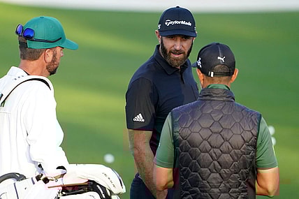 Apr 5, 2022; Augusta, Georgia, USA; Dustin Johnson hits at the practice facility during a practice round of The Masters golf tournament at Augusta National Golf Club. Mandatory Credit: Danielle Parhizkaran-Augusta Chronicle/USA TODAY Network

Golf Masters Tournament Practice Round