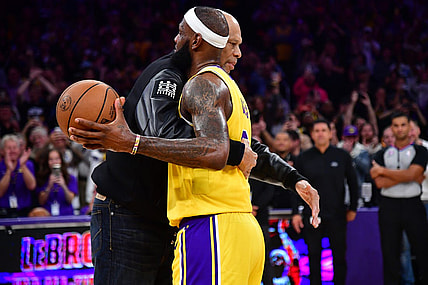 Feb 7, 2023; Los Angeles, California, USA; Former Los Angeles Lakers player Kareem Abdul-Jabbar hugs forward LeBron James (6) after James becomes the all time NBA scoring leader againt the Oklahoma City Thunder during the second half at Crypto.com Arena. Mandatory Credit: Gary A. Vasquez-USA TODAY Sports
