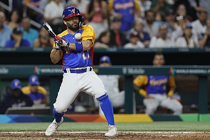 Mar 18, 2023; Miami, Florida, USA; Venezuela second baseman Jose Altuve (27) gets hit by a pitch during the fifth inning against the USA at LoanDepot Park. Mandatory Credit: Sam Navarro-USA TODAY Sports