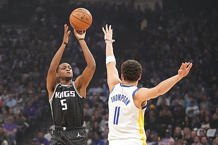 April 17, 2023; Sacramento, California, USA; Sacramento Kings guard De'Aaron Fox (5) shoots the basketball against Golden State Warriors guard Klay Thompson (11) during the first quarter in game two of the first round of the 2023 NBA playoffs at Golden 1 Center. Mandatory Credit: Kyle Terada-USA TODAY Sports