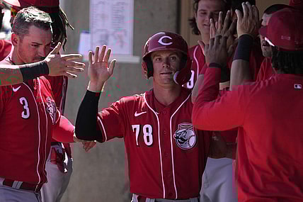 Mar 26, 2023; Salt River Pima-Maricopa, Arizona, USA; Cincinnati Reds second baseman Matt McLain (78) celebrates with teammates after scoring a run against the Colorado Rockies in the third inning at Salt River Fields at Talking Stick. Mandatory Credit: Rick Scuteri-USA TODAY Sports