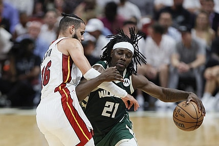 Apr 22, 2023; Miami, Florida, USA; Milwaukee Bucks guard Jrue Holiday (21) drives to the basket against Miami Heat forward Caleb Martin (16) in the third quarter during game three of the 2023 NBA Playoffs at Kaseya Center. Mandatory Credit: Sam Navarro-USA TODAY Sports
