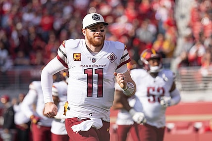 Dec 24, 2022; Santa Clara, California, USA;  Washington Commanders quarterback Carson Wentz (11) runs onto the field before the start of the first quarter against the San Francisco 49ers at Levi's Stadium. Mandatory Credit: Stan Szeto-USA TODAY Sports