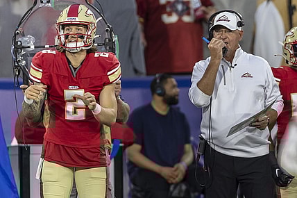 Apr 15, 2023; Birmingham, AL, USA; Birmingham Stallions quarterback Alex McGough (2) signals in the play as Birmingham Stallions head coach Skip Holtz talks on a walkie-talkie during the first half of a USFL football game against the New Jersey Generals at Protective Stadium. Mandatory Credit: Vasha Hunt-USA TODAY Sports