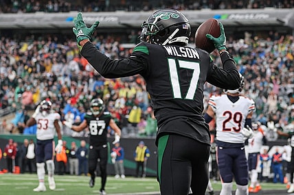 Nov 27, 2022; East Rutherford, New Jersey, USA; New York Jets wide receiver Garrett Wilson (17) celebrates his touchdown reception during the first quarter against the Chicago Bears at MetLife Stadium. Mandatory Credit: Vincent Carchietta-USA TODAY Sports