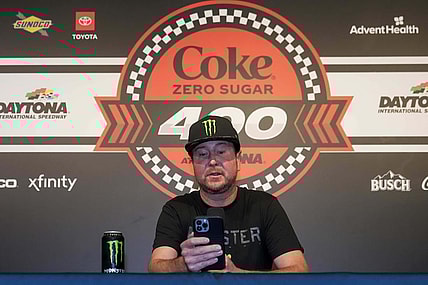 Aug 26, 2023; Daytona Beach, Florida, USA;  Kurt Busch reads from a prepared statement announcing his retirement prior to the Coke Zero Sugar 400 at Daytona International Speedway. Mandatory Credit: David Yeazell-USA TODAY Sports