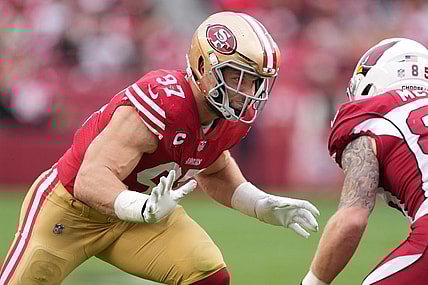 Jan 8, 2023; Santa Clara, California, USA; San Francisco 49ers defensive end Nick Bosa (97) rushes against Arizona Cardinals tight end Trey McBride (85) during the third quarter at Levi's Stadium. Mandatory Credit: Darren Yamashita-USA TODAY Sports